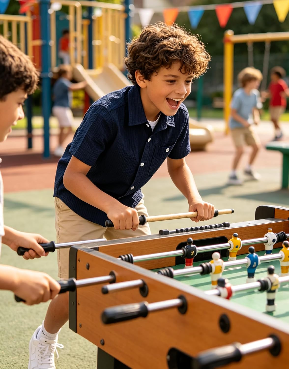 Boy playing table football in a navy striped polo shirt designed for comfortable everyday movement.