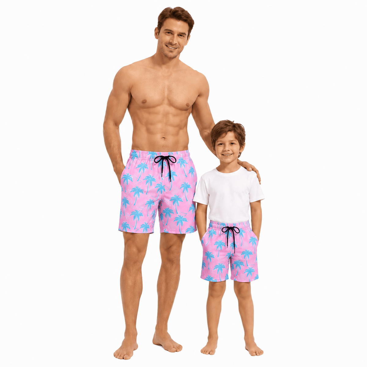Father and son wearing matching pink maple leaf swim trunks with quick dry fabric, stylish family swimwear for beach vacations.