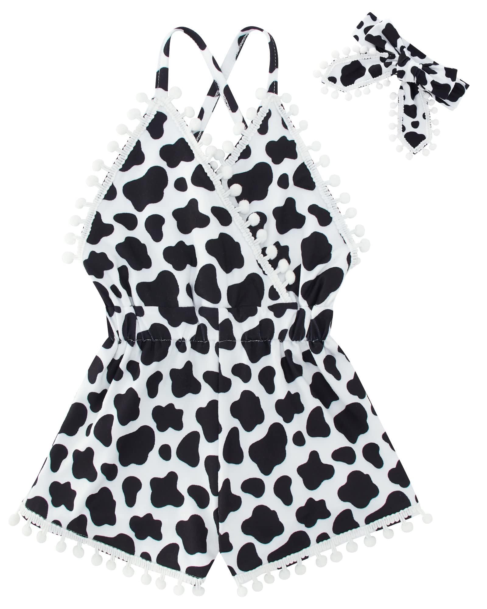 Girls black and white cow print romper dress with headband, cute toddler summer outfit with playful animal pattern.