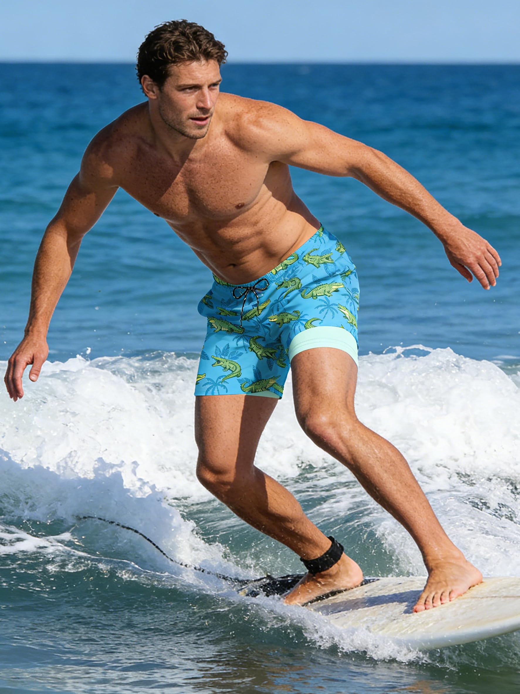 Man wearing tropical swim trunks while surfing during a beach vacation