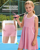 Girl wearing a pink casual dress set with matching shorts, perfect outfit for summer activities, travel and daily wear.