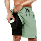 Men's apple green 2-in-1 workout shorts with compression liner.