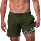 Men's army green swim trunks with built-in liner and tropical patterned inner shorts
