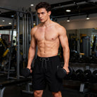 Men's athletic workout shorts with compression liner for gym workouts.
