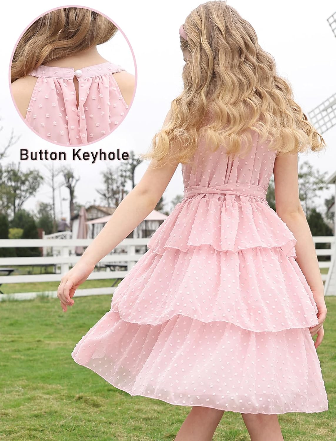 back view of girls pink swiss dot layered dress featuring button keyhole back and adjustable waist tie