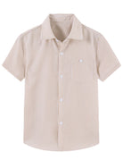 Beige boys short sleeve polo shirt with a relaxed resort-style look.