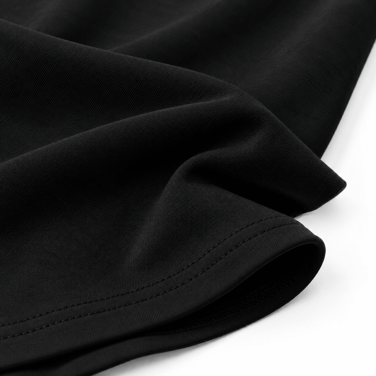 Close-up of the black girls swing dress showing the gathered waist detail and flowing A-line skirt construction.