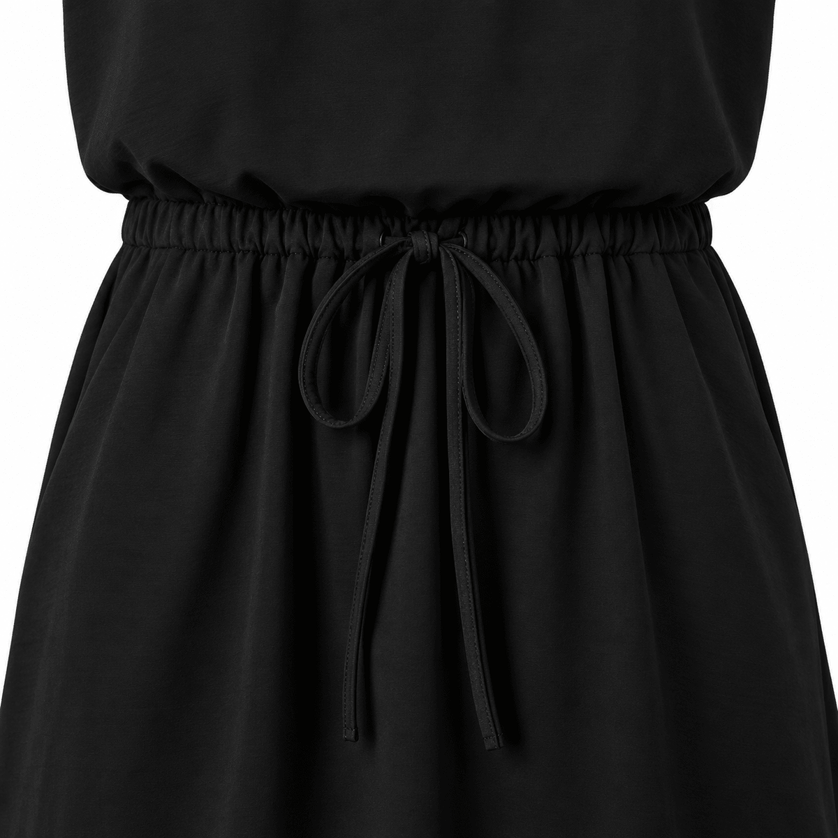 Close-up of the black girls swing dress showing the gathered waist detail and flowing A-line skirt construction.