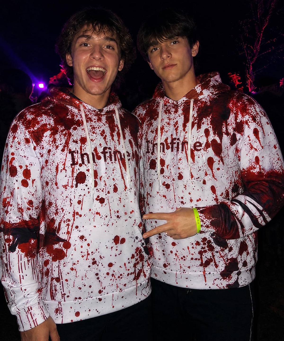 Men wearing Blood Splatter graphic hoodies together in a Halloween setting, showing the bold red horror print and casual pullover fit.