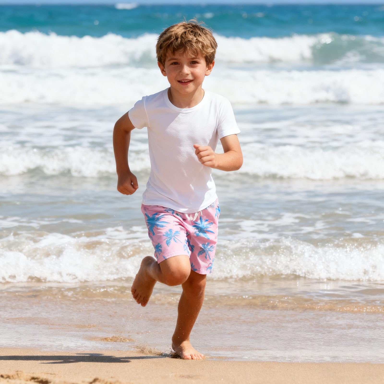 Boy wearing tropical palm tree swim shorts during a beach day, comfortable quick dry swim trunks for outdoor activities.