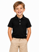 Boy wearing a black polo shirt matching his father's outfit, comfortable kids top for family occasions and casual wear.