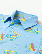 Close-up of boys blue printed polo shirt showing the classic collar, neckline construction and colorful all-over print.