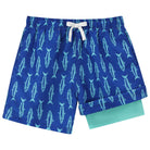 Boys blue fish printed swim trunks with comfortable liner and adjustable waistband for swimming and summer wear.