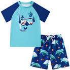 Boys blue turtle printed swim set with short sleeve top and swim shorts, ocean themed beachwear for kids.