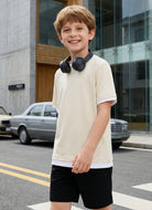 Boy wearing a casual color block short sleeve T shirt with relaxed fit, perfect for school and everyday activities.