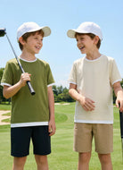 Boys wearing color block short sleeve T shirts during outdoor activities, comfortable casual outfits for summer days.