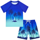 Boys deep blue Hawaii inspired swim set with printed swim shorts, stylish beachwear for kids vacations.