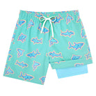 Boys green shark swim shorts with ocean inspired print, perfect for swimming, surfing and beach play.