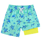 Boys green turtle printed swim trunks with lightweight fabric and comfortable fit for beach and pool days.