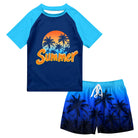 Boys Navy Hawaii swim set with navy short sleeve tropical rash guard and coordinating dark blue printed swim trunks.