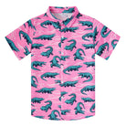 Boys pink short sleeve button-down shirt with green crocodile print, classic collar and playful casual summer design.