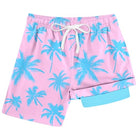 Boys pink palm tree printed swim trunks with drawstring waist and compression liner, tropical beach shorts for summer.