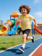 Boy wearing a striped polo shirt during outdoor sports activities, showing a comfortable fit and classic casual style.