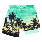 Boys tropical palm tree board shorts featuring stretch fabric and comfortable liner for beach adventures.