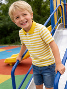 Boy wearing a yellow striped polo shirt, showing the classic collar design and comfortable everyday style.