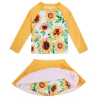 Girls Sunflower long sleeve rash guard swim set with matching skirted bottom and colorful floral print for beach, pool and summer vacation wear.