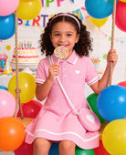 cute girl wearing polo dress outfit for birthday party and summer events