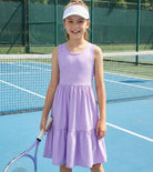 Girl wearing a purple rainbow strap sundress during outdoor activities, perfect casual summer outfit for vacations and family outings.