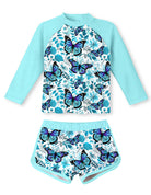 Girls blue butterfly print long sleeve rash guard swimsuit set with shorts, comfortable UPF 50 swimwear for beach and pool days.