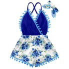 Girls blue flower rainbow strap sundress with floral print skirt, cross straps and pom pom details, cute summer dress for vacations and everyday wear.