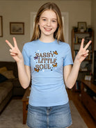 Girl wearing a blue graphic short sleeve tee with casual styling, perfect for school, travel and everyday activities.