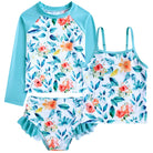 Girls blue pattern three piece swim set featuring long sleeve rash guard, tankini top and ruffle shorts.