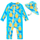Toddler girls blue pineapple print long sleeve rash guard swimsuit with matching sun hat and full coverage design for beach and pool days.