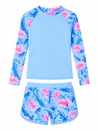Girls blue printed long sleeve rash guard swimsuit set with matching swim shorts, removable pads and comfortable stretch material for water activities.