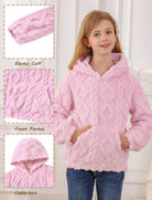 Close-up detail of girls coral fleece hoodie showing the soft plush fabric, hood design and textured surface for a warm winter layer.