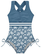 Girls dark blue floral one piece swimsuit with cross back design, stretch fabric and colorful flower print for summer swimming.