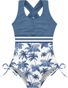 Girls dark blue one piece swimsuit with cross back straps and comfortable stretch fabric for swimming lessons and beach days.