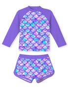 Girls deep purple mermaid pattern swimwear set featuring long sleeve rash guard top and comfortable swim shorts.
