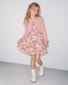 Front view of a girl wearing the Pink Daisy Floral dress and matching cardigan, showing the colorful floral print and coordinated outfit style.