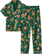 Girls green Christmas pajama set with festive print, short sleeve top and long pants made from soft stretch fabric for holiday sleepwear.