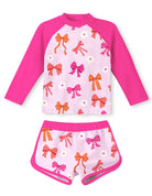 Girls hot pink bow print swimsuit set with long sleeve rash guard top and shorts, cute fashionable swimwear for girls.