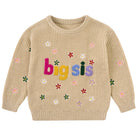 Girls khaki knit sweater with colorful Big Sis lettering and small floral graphics, designed for comfortable fall and winter outfits.