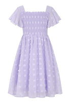 Girls lavender Swiss dot chiffon dress with ruffle sleeves, square neckline and flowing skirt, elegant outfit for special occasions.
