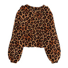 Girls leopard print fleece pullover hoodie with soft fabric and relaxed long sleeve fit for playful fall and winter casual outfits.