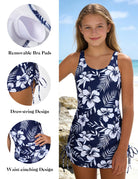 Girls navy floral one piece swim dress swimsuit featuring removable bra pads, adjustable side drawstring, and waist cinching design for comfortable beachwear.