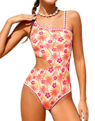 Girls Orange Floral Print one piece swimsuit with side cutout, asymmetrical strap and flexible fabric for beaches, pools and summer vacations.